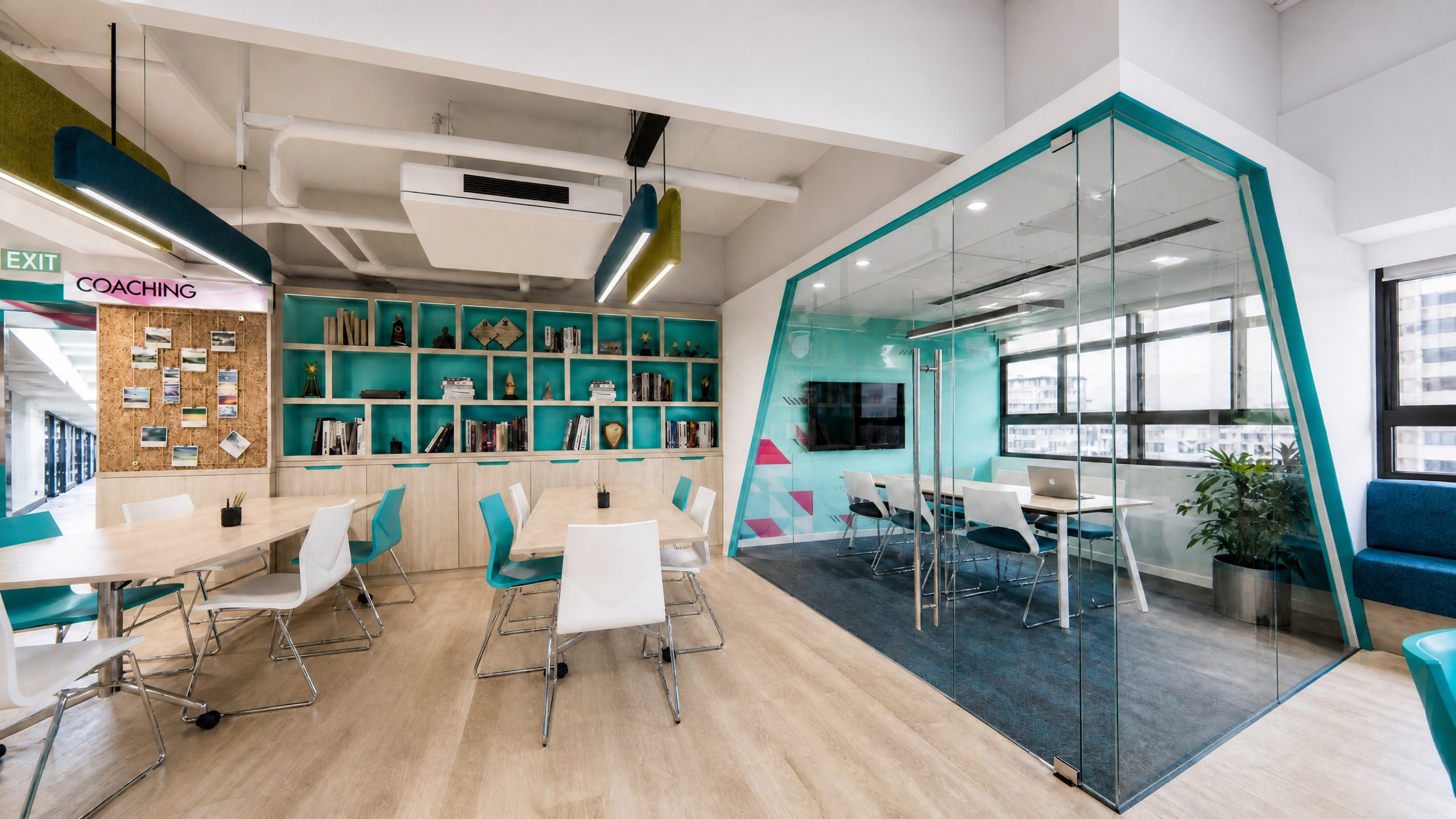 Achievers Coaching Academy meeting and study areas with glazed rooms, teal frames and bespoke bookshelves