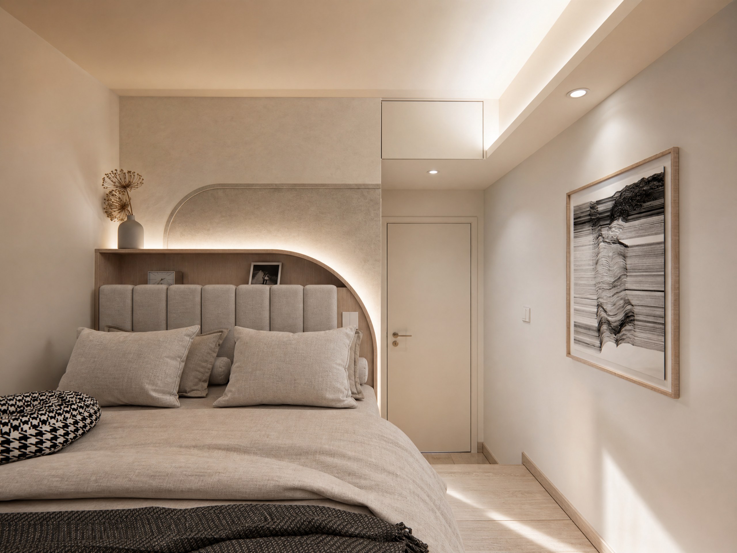 Discovery Park bedroom with curved headboard lighting, a fluted upholstered headboard and artwork