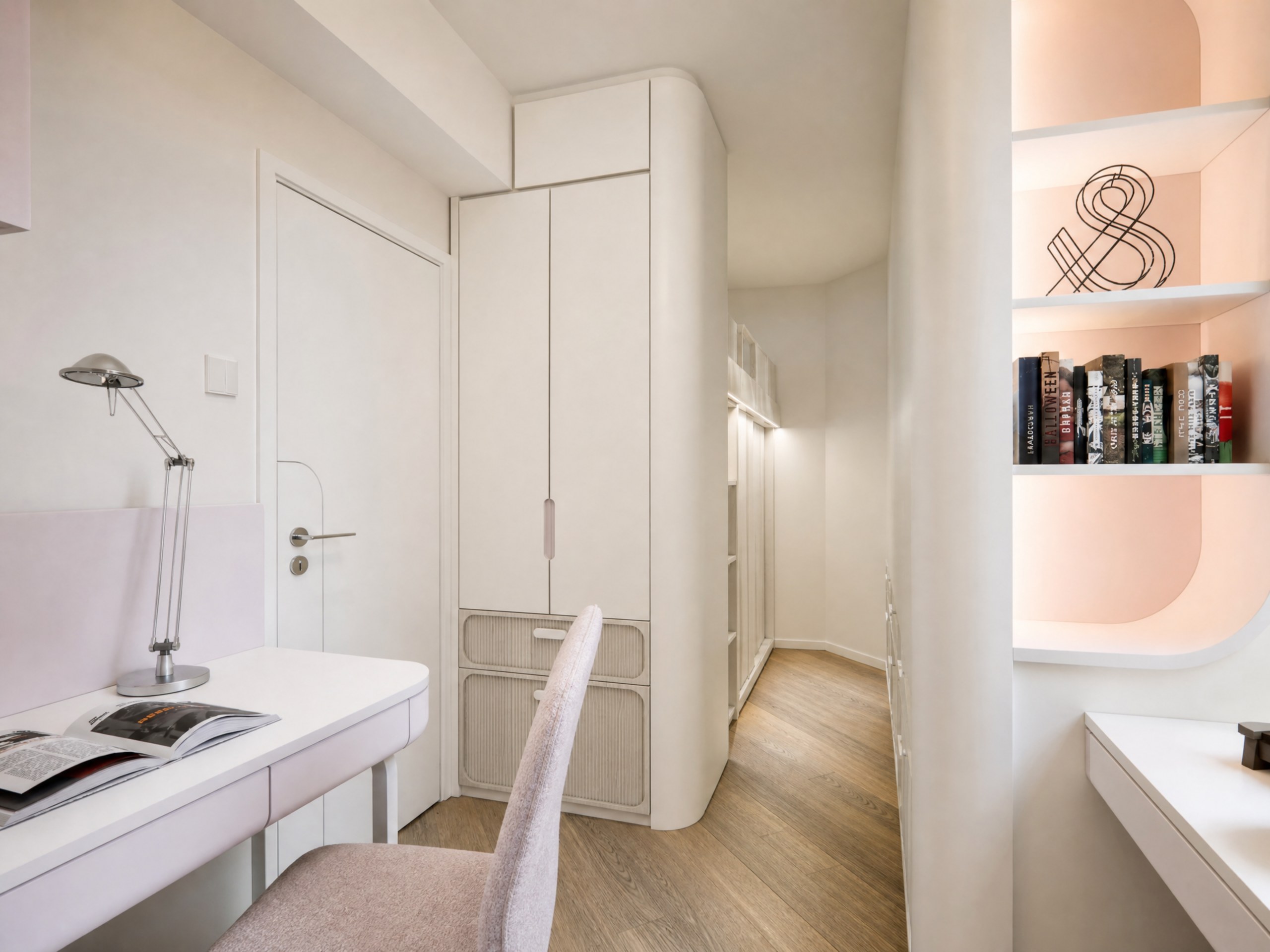 Discovery Park corridor with tall curved white cabinets, a desk space and display shelves