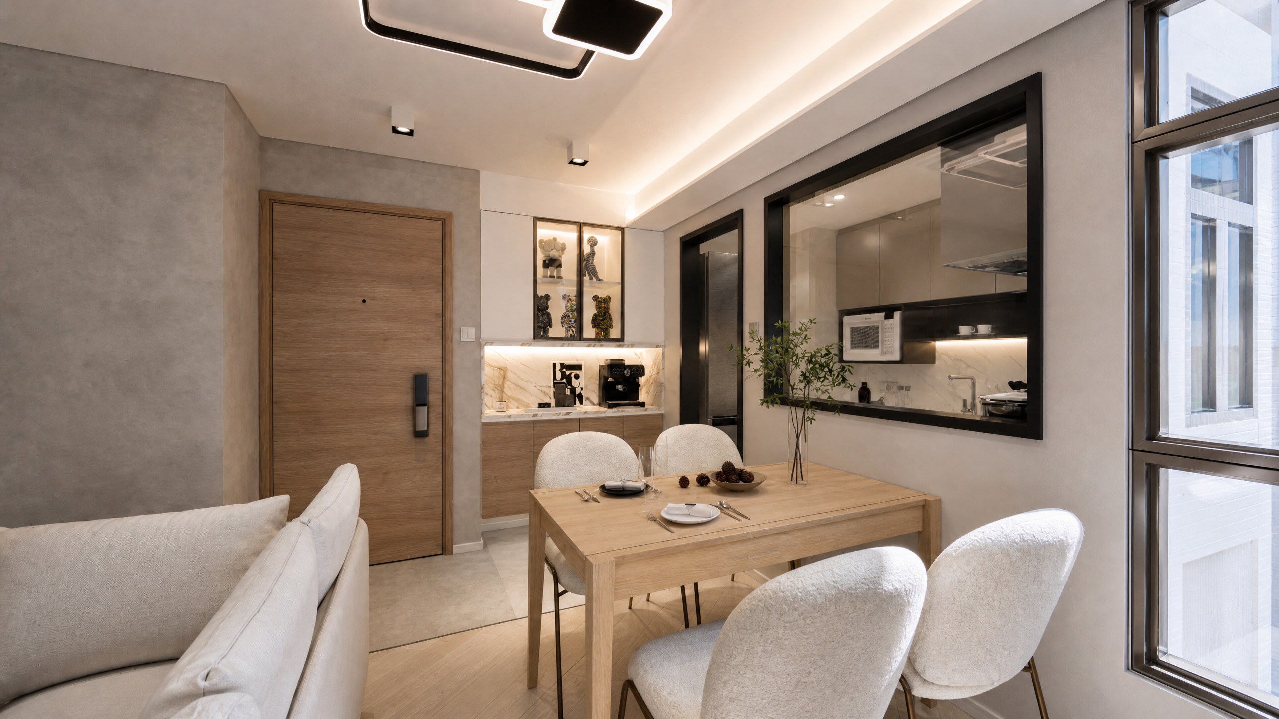 Mei Foo Sun Chuen dining area and kitchen with a timber table and black-framed glass partition