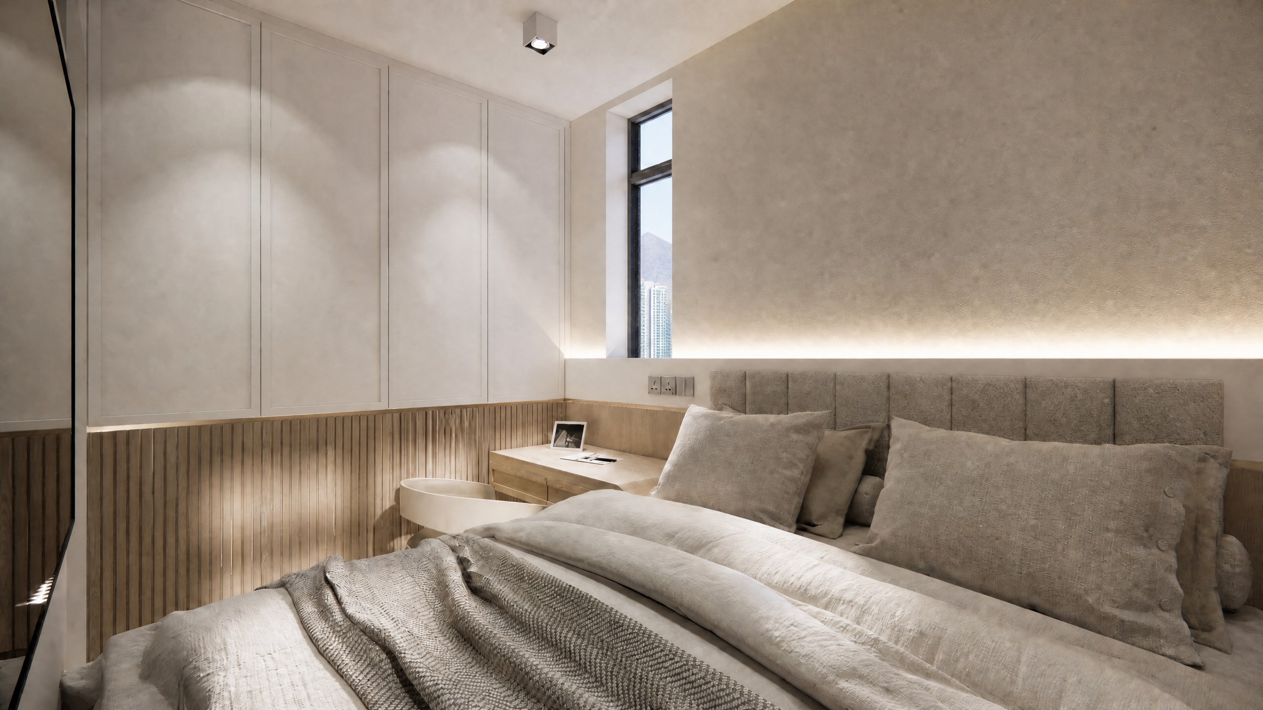 Yu Nga Court bedroom with a grey upholstered headboard, timber-slat wall and warm wall lights